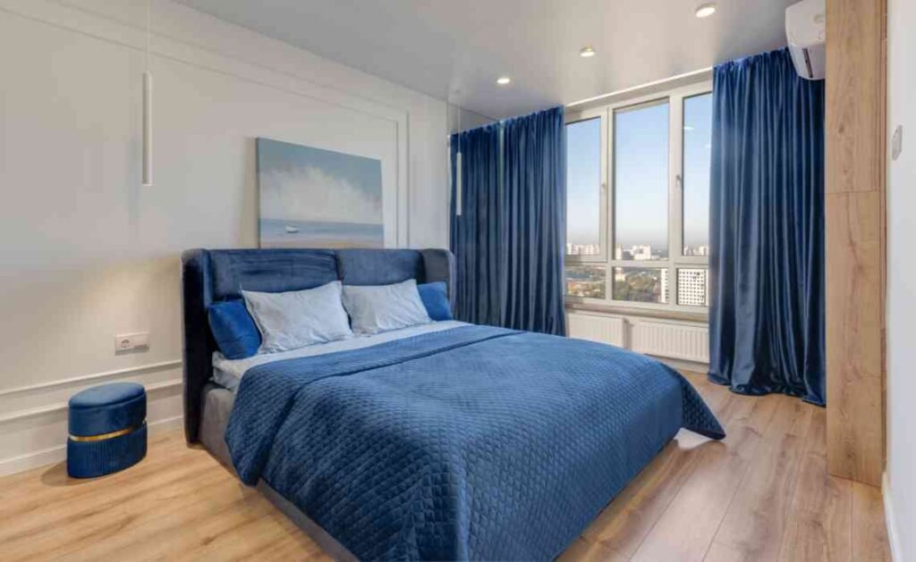 curtains enhance the beauty of the bedroom interior decor - blue curtains and bedsheets
